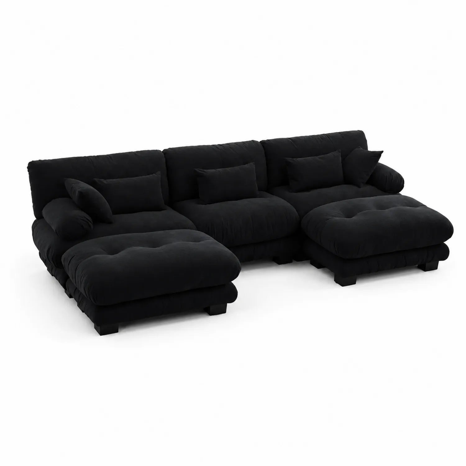 Czarna modułowa sofa narożna z szezlongiem i poduszkami
